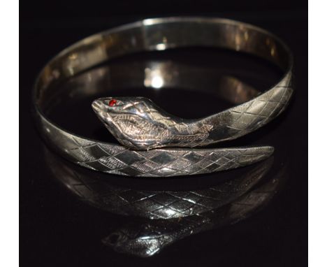 A gold plated on silver snake/ serpent bangle, London 1975, 6cm diameter