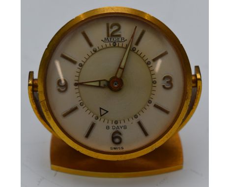 Jaeger (LeCoultre) travelling desk or alarm clock with luminous hands, gold hour markers, cream dial and gilt case and stand,