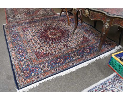 Moud Carpet of Unusual Size, the cream Herati field with a central flowerhead medallion framed by mid-indigo borders of samov