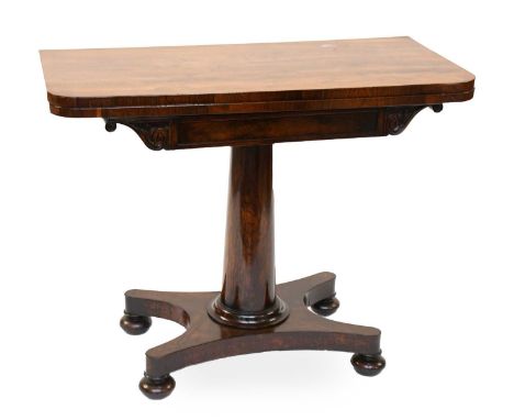 A Regency Rosewood Foldover Card Table, the tapering cylindrical support on a waisted x-form base and flattened bun feet, 91c
