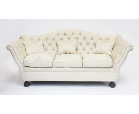 A Victorian Hump Back Sofa, with buttoned damask upholstery on carved bun feet, 210cm by 90cm by 92cmSome very minor movement