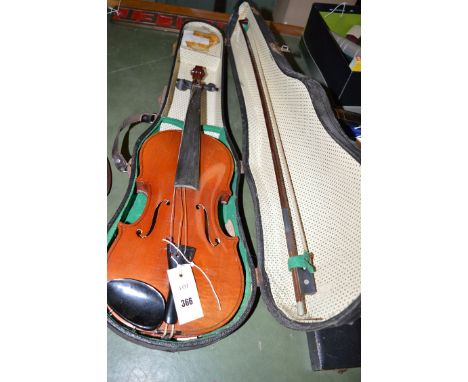 A modern violin and bow in fitted case.