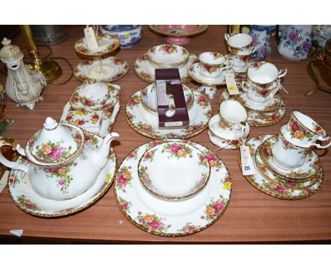 A quantity of Royal Albert 'Old Country Roses' tea and dinner ware, approximately six place settings, plus: teapot; cake stan