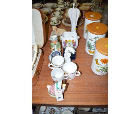 A Royal Albert 'Jemima Duck'; three commemorative mugs; a tea caddy; a character jug 'The Coachman'; etc.