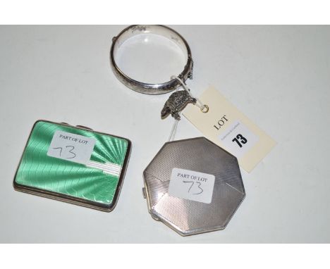 A silver bangle; a marcasite set tortoise pattern brooch; a silver and green enamel Art Deco cigarette case with gilt interio