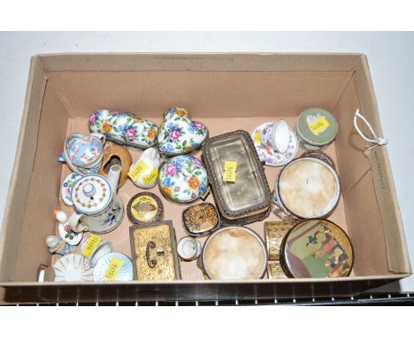 A collection of ceramic boxes with hinged covers; miniature tea cup and saucer; other miniature pieces of decorative china an