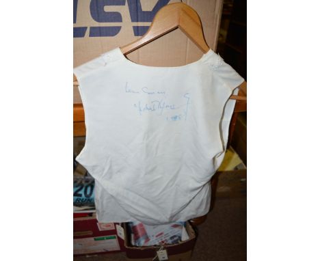 Michael Jackson: a signed lady's blouse by Elizabeth Shelton, size 12, signed to the back by Michael Jackson dated 1988.