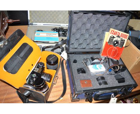 An Exacta camera, lenses and accessories, in a fitted case; a Praktica Jenaflex camera and lenses; a carrying case; and a Pra