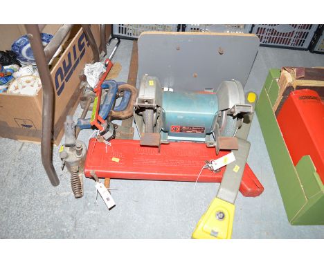 A Black & Decker bench grinder; C-clamps; warning triangle; etc.