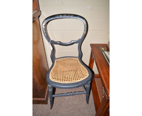 A pair of black lacquered, gilt and mother-of-pearl inlaid balloon-back occasional chairs, the cane seats raised on turned le