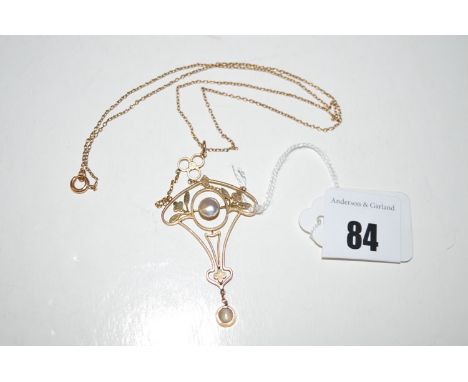 An Edwardian yellow metal and blister pearl set pendant, on trace link chain.