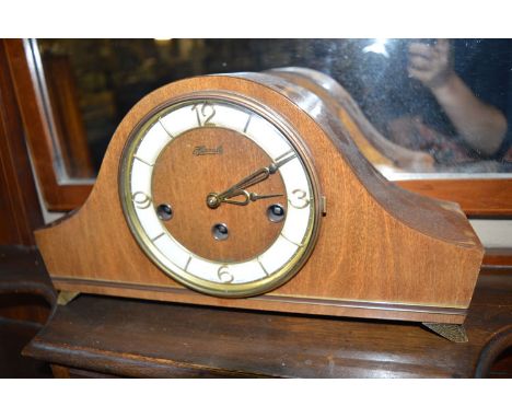 A Hermle mahogany cased mantel clock.