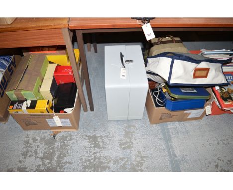 A collection of film projectors; film cameras; speaker in a cabinet; and related sundries, in two boxes.