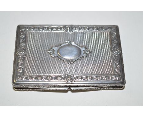 A reproduction 900 standard silver snuff box, decorated with floral and mask design.