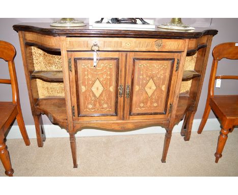 A late Victorian inlaid rosewood serpentine front cabinet, fitted a single frieze drawer flanked by reeded inlaid panels, abo