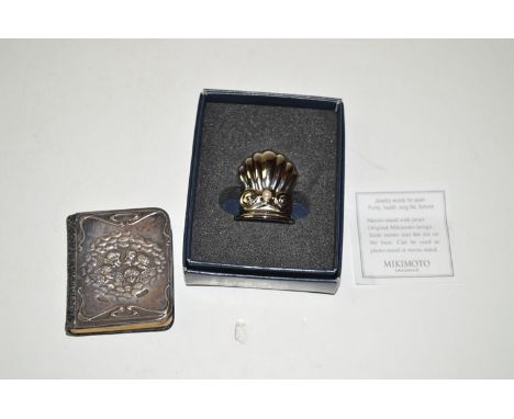 A silver mounted Common Prayer Book; together with a white metal and Mikimoto pearl set menu stand.