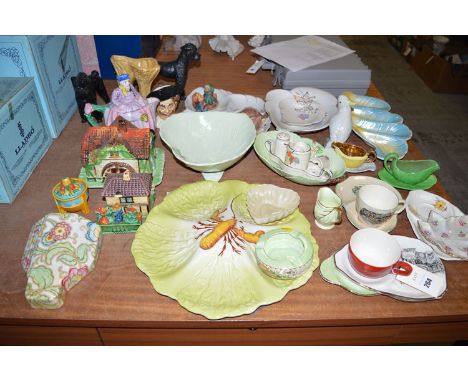 A quantity of decorative ceramics, including: Carlton ware; two Hummel figures; an Arthur Woods novelty teapot; etc.