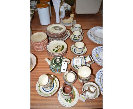 A quantity of Devon Motto Ware and Torquay Ware, including: cups, saucers, plates, teapot, sugar and cream, etc.