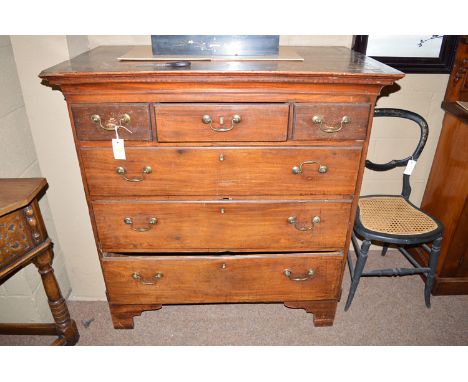 A George III mahogany chest of three short and three long graduated drawers fitted brass bow pattern handles, raised on later