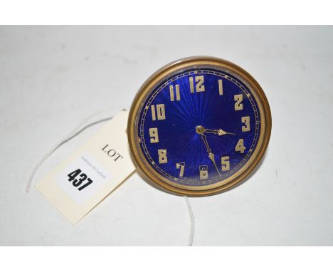 An early 20th Century travelling clock, with circular blue enamel dial and arabic numerals, fitted eight day movement and num