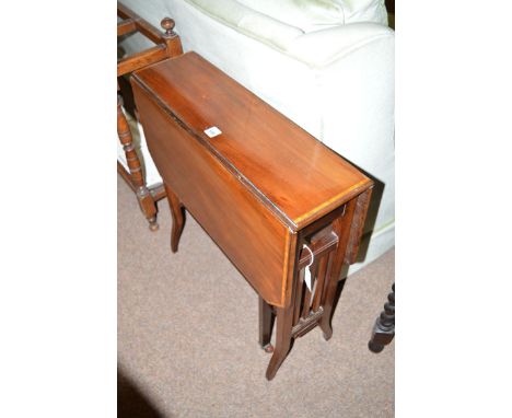 A late 19th Century inlaid mahogany Sutherland table with ceramic castors.