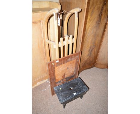 A wooden sledge; an inlaid firescreen; and an ebonised footstool.  (3)