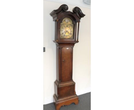An oak thirty hour long case clock, the arched brass dial signed Taylor, Kirby, with another inscription Thos &amp; Jane Raic