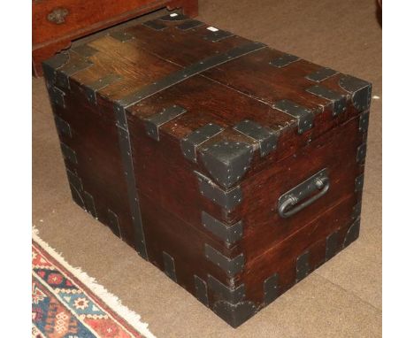 A 19th century iron bound wooden trunk 
