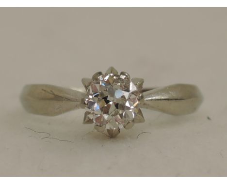 A ladies diamond solitaire ring, approx .45ct in a double claw set mount on a white metal loop stamped 750