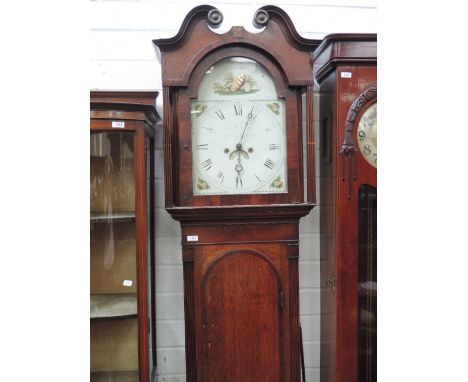 An oak and mahogany longcase clock having pillar swan neck with painted dial and eight day movement on pillar and arch trunk 