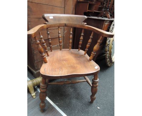 A 19th century re-stained beech and elm smoker's bow armchair on turned legs