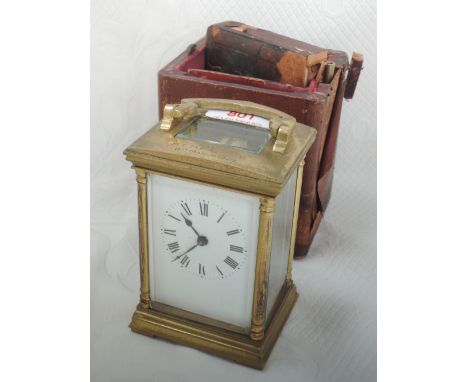 An early 20th century brass carriage clock of traditional design, engraved March 1929, in fitted case