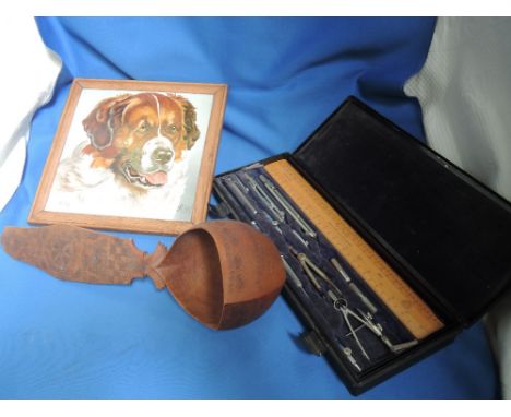 A vintage drawing instrument set, a ceramic tile A Williams, St Bernard dog and a treen Kovsh 