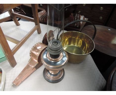 A vintage brass jam pan, a copper oil lamp and a set of early 20th century oak and brass bellows