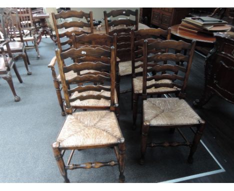 A late 20th century oak Jacobeon style dining suite comprising table with oval top and turned gate legs and a  set of 6 (4+2)