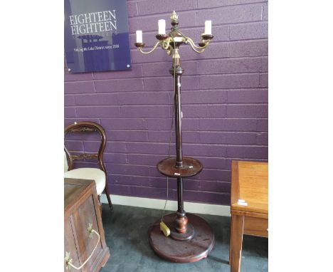 A modern mahogany period style torchere lamp having brass candelabrum top