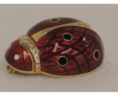 A yellow metal brooch modelled as a ladybird having enamel and diamond decoration, no marks tested as 18ct gold