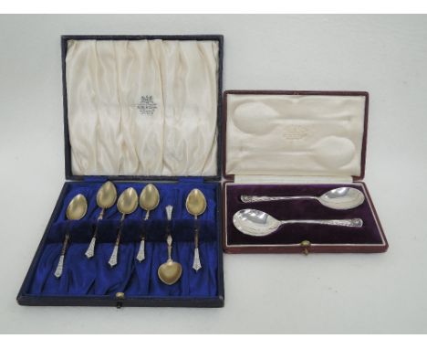 A cased set of Norwegian coffee spoons having gilt wire and white enamel decoration, bearing marks possibly early David Ander