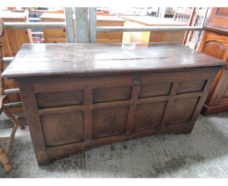 An 18th century and later oak kist/coffer having plank top and panel base