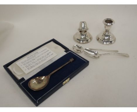 A cased HM silver spoon replicating the Leicester seal top spoon, a Georgian silver caddy spoon having bright cut decoration,