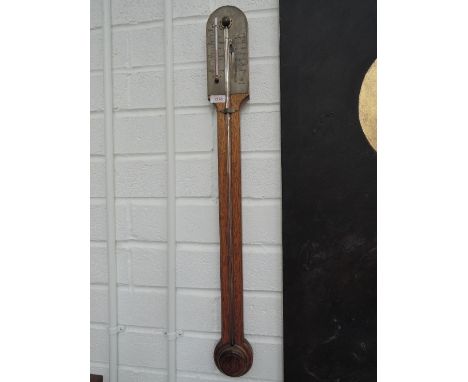 A 20th century mahogany reproduction stick barometer in the period style