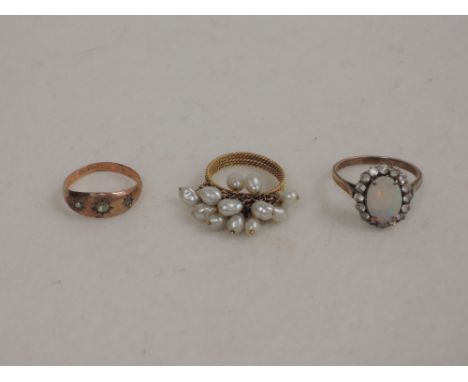 Three ladies dress rings including faux opal, freshwater pearls and yellow metal stamped 9ct