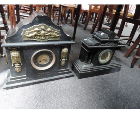 A late Victorian black slate mantel clock of architectural style and a similar clock