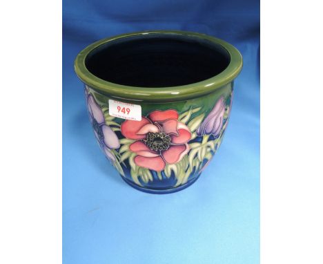 A modern Moorcroft jardiniere planter having floral poppy pattern on green and black ground, stamped and painted marks to bas