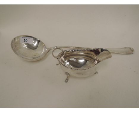 A small silver sauce boat having pinched rim, scroll handle and trefoil hoof feet, London 1899, makers marks worn,  approx 75