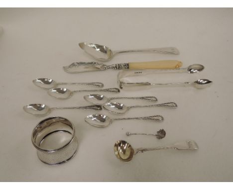 A selection of HM silver flatware including Georgian silver dessert spoon, Victorian salt spoon, sugar nips and butter knife,