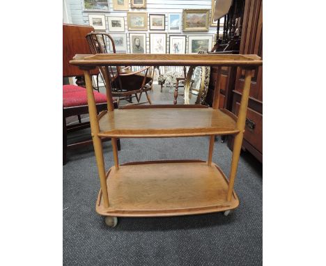 A 1960's/70's design elm Ercol three tier trolley table