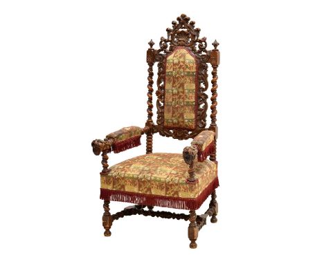 Late 19th century carved walnut throne chair, with foliate scroll back with barley twist supports and shell surmount, each ar