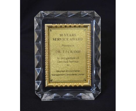 Chow Tai Fook 9999 gold thin presentation plaque for 10 years of service, encased in plastic frame, 22cm x 16cm high (overall