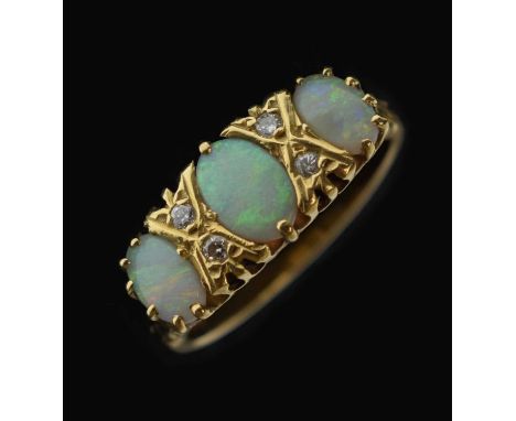 Opal and diamond 18ct gold ring, the three graduated oval opal cabochons with pairs of diamonds inbetween, London, 1973, size